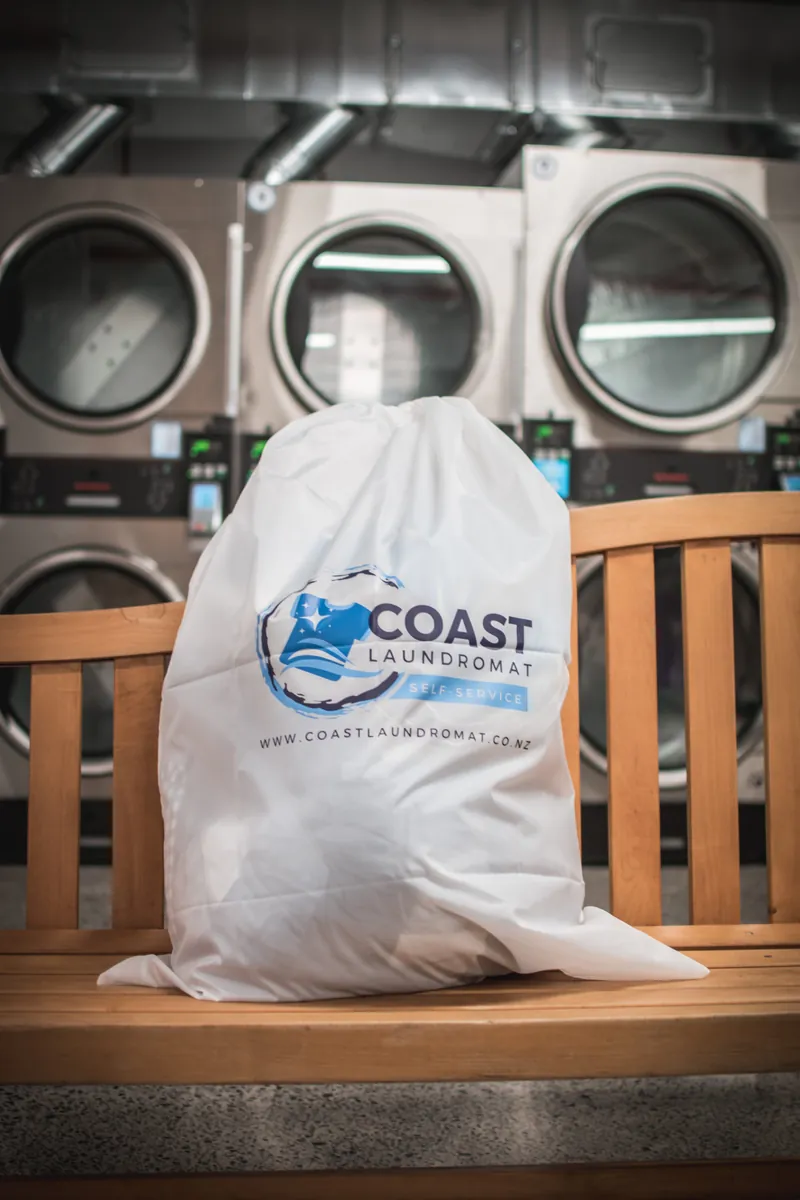 Vending machine at Coast Laundromat Whangaparaoa — re-usable laundry bags just $10